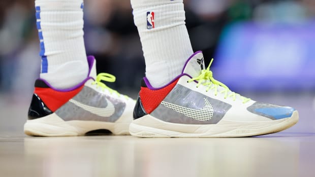 View of Jalen Brunson's grey and red Nike Kobe 5 basketball shoes.