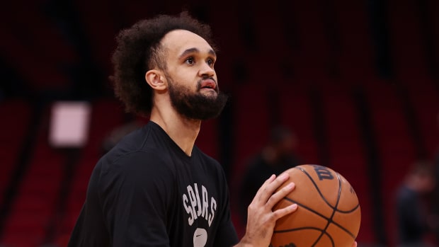 Jan 25, 2022; Houston, Texas, USA; San Antonio Spurs guard Derrick White (4) warms up before the game against the Houston Rockets at Toyota Center.