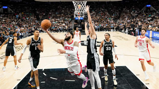 Rockets guard Fred VanVleet dries to the basket past San Antonio Spurs center Zach Collins during the second half at Frost Bank Center.