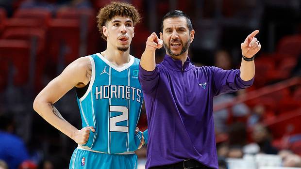 Charlotte Hornets guard LaMelo Ball (2) and head coach James Borrego talk during a time out in the first half against the Miami Heat at FTX Arena.