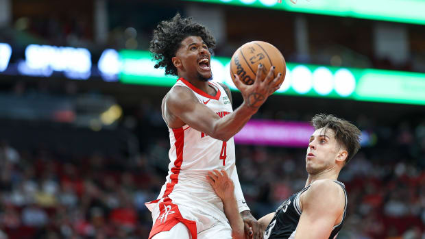 Rockets guard Jalen Green (4) shoots the ball as San Antonio Spurs forward Zach Collins (23) defends during the second half at Toyota Center.