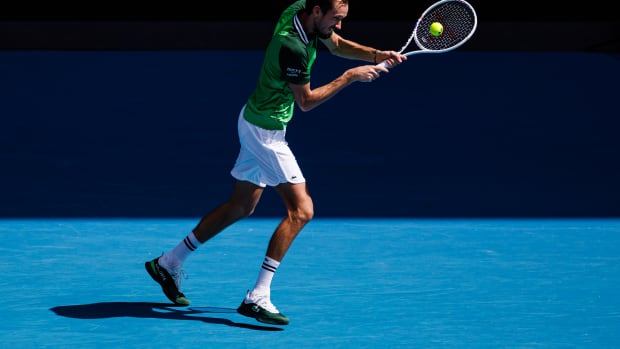 Daniil Medvedev returns a serve during the 2024 Australian Open.
