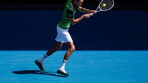 Daniil Medvedev returns a serve during the 2024 Australian Open.