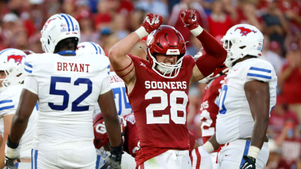 Oklahoma's Danny Stutsman (28) celebrates a play next to SMU's Sean Kane (52) in the second half of the college football game between the University of Oklahoma Sooners and the Southern Methodist University Mustangs at the Gaylord Family Oklahoma Memorial Stadium in Norman, Okla., Saturday, Sept. 9, 2023.  