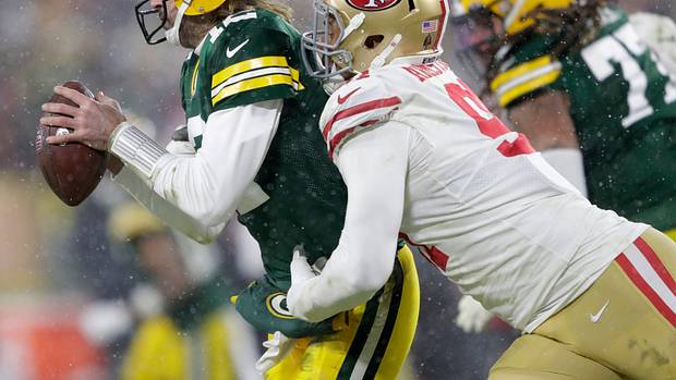 Arik Armstead of the San Francisco 49ers sacks the Green Bay Packers Aaron Rodgers