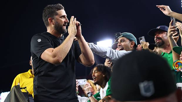 Philadelphia Eagles head coach Nick Sirianni celebrates with the fans.