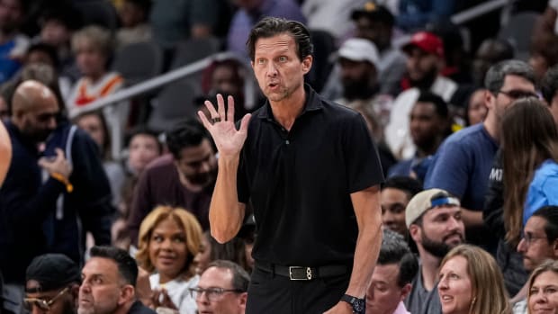 Atlanta Hawks coach Quin Snyder instructs his team from the sidelines.