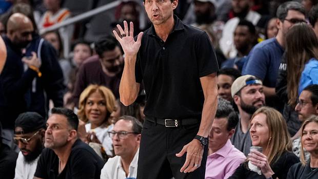 Atlanta Hawks coach Quin Snyder instructs his team from the sidelines.