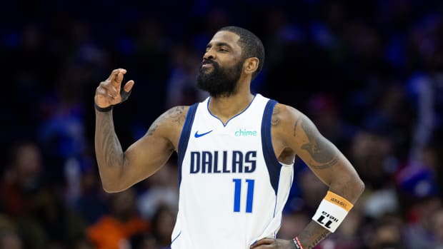 Dallas Mavericks guard Kyrie Irving gestures during a game against the Philadelphia 76ers.
