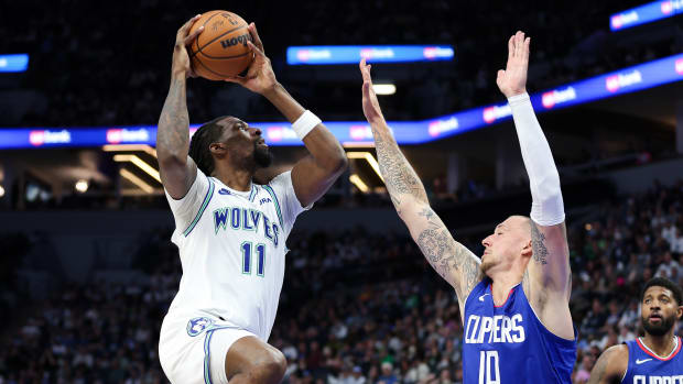 Minnesota Timberwolves center Naz Reid (11) shoots as LA Clippers center Daniel Theis (10) defends during the first half at Target Center in Minneapolis on March 3, 2024.