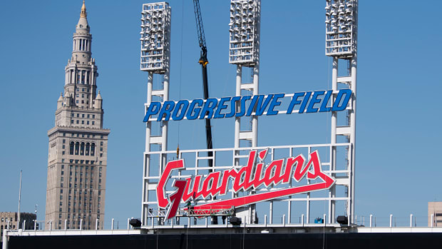 Mar 17, 2022; Cleveland, OH, USA; Workers from the Brilliant Electric Sign Company install the final letter to the new Cleveland Guardians sign on the scoreboard at Progressive Field. Mandatory Credit: Ken Blaze-USA TODAY Sports