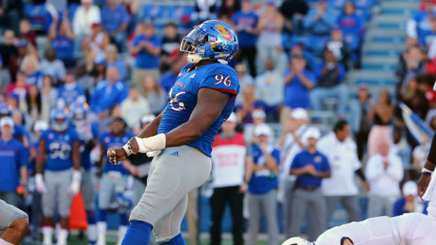 Oct 27, 2018; Lawrence, KS, USA; Kansas Jayhawks defensive tackle Daniel Wise (96) celebrates after a sack against TCU Horned Frogs quarterback Michael Collins (10) in the second half at Memorial Stadium. Mandatory Credit: Jay Biggerstaff-USA TODAY Sports