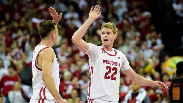 Wisconsin forwards Steven Crowl and Tyler Wahl high-five after beating Maryland.