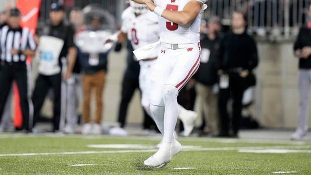 Wisconsin quarterback Graham Mertz throwing the football against Ohio State.