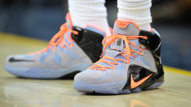 View of LeBron James' blue and orange Nike shoes.