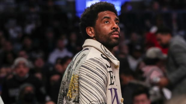 Brooklyn Nets point guard Kyrie Irving wore expensive sneakers at his community event in New Jersey. Irving wore Nike and Air Jordans at the 'More Than a Run' event.