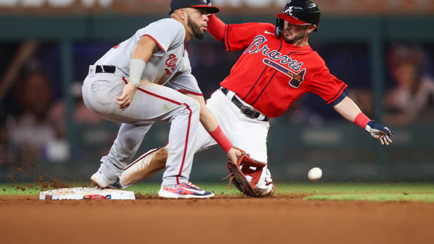 Sep 29, 2023; Atlanta, Georgia, USA; Atlanta Braves center fielder Forrest Wall (73) steals second past Washington Nationals second baseman Luis Garcia (2) in the seventh inning at Truist Park.