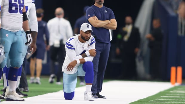 Dallas Cowboys quarterback Dak Prescott looks on from the sidelines during a preseason game.
