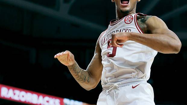 Arkansas Razorbacks guard Au'Diese Toney (5) celebrates after dunking the ball in the second half against the West Virginia Mountaineers at Bud Walton Arena. Arkansas won 77-68.