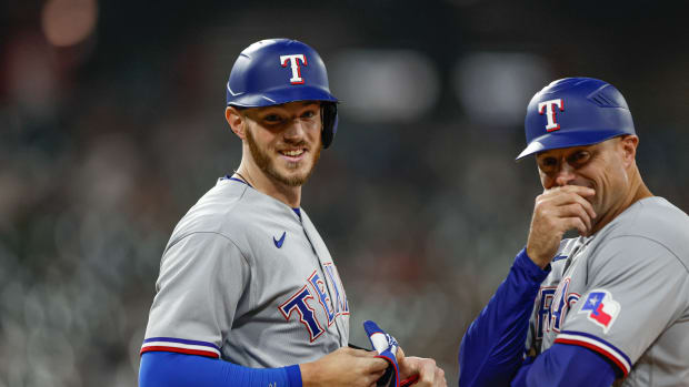 Jun 19, 2023; Chicago, Illinois, USA; Texas Rangers catcher Jonah Heim (28) (left) smiles after hitting a two-run single against the Chicago White Sox during the seventh inning at Guaranteed Rate Field. Mandatory Credit: Kamil Krzaczynski-USA TODAY Sports