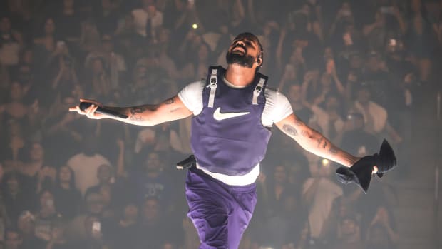 Drake runs on stage during his concert in Glendale, Arizona.