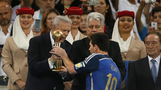 Lionel Messi pictured collecting the Golden Ball trophy after the 2014 FIFA World Cup in Brazil