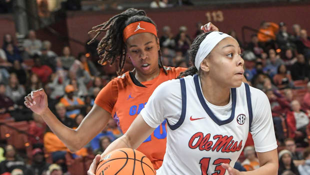 Ole Miss guard Mariyah Noel (13) dribbles by Florida guard Jeriah Warren (20) during the first quarter of the SEC Women's Basketball Tournament game at the Bon Secours Wellness Arena in Greenville, S.C. Friday, March 8, 2024.