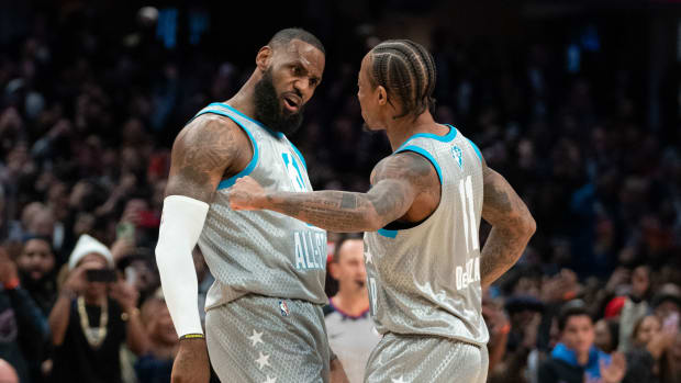 February 20, 2022; Cleveland, Ohio, USA; Team LeBron forward LeBron James of the Los Angeles Lakers (6) celebrates with Team LeBron guard/forward DeMar DeRozan of the Chicago Bulls (11) after making the game-winning basket during the fourth quarter in the 2022 NBA All-Star Game at Rocket Mortgage FieldHouse.