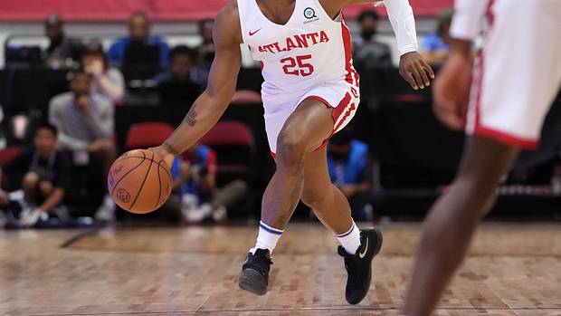 Tyson Etienne dribbles during a summer league game.