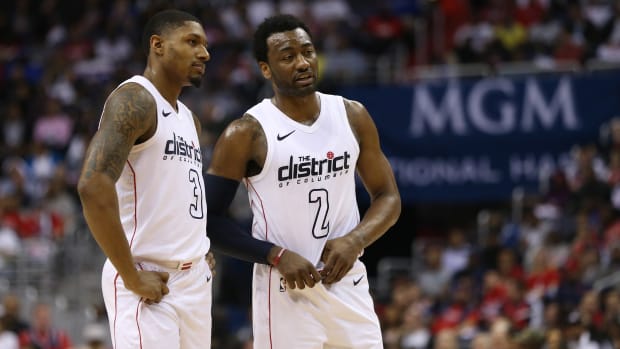 Washington Wizards guard Bradley Beal (3) talks with Washington Wizards guard John Wall (2) against the Toronto Raptors in the second quarter in game four of the first round of the 2018 NBA Playoffs at Capital One Arena. The Wizards won 106-98. Mandatory Credit Geoff Burke-USA TODAY Sports