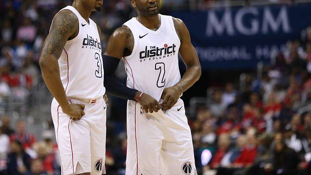 Washington Wizards guard Bradley Beal (3) talks with Washington Wizards guard John Wall (2) against the Toronto Raptors in the second quarter in game four of the first round of the 2018 NBA Playoffs at Capital One Arena. The Wizards won 106-98. Mandatory Credit Geoff Burke-USA TODAY Sports
