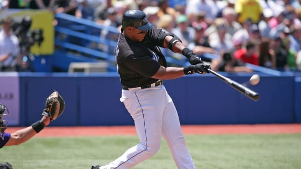 Toronto Blue Jays designated hitter Frank Thomas hits a home run.