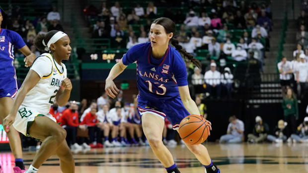 Feb 26, 2022; Waco, Texas, USA; Kansas Jayhawks guard Holly Kersgieter (13) drives to the basket against Baylor Lady Bears guard Ja'Mee Asberry (21) during the first half at Ferrell Center. Mandatory Credit: Chris Jones-USA TODAY Sports