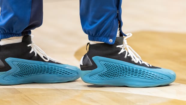 Minnesota Timberwolves guard Anthony Edwards' blue and black adidas sneakers.