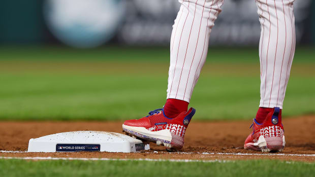 View of Bryce Harper's cleats as he stands on first base.