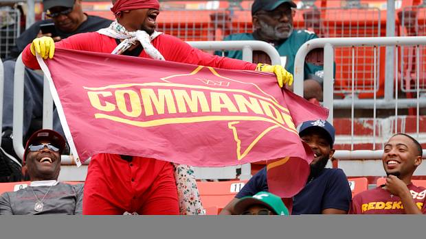Washington Commanders fans cheer on their team at FedEx Field.
