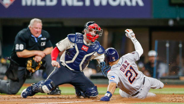 Jun 30, 2023; Arlington, Texas, USA; Houston Astros catcher Yainer Diaz (21) slides home safely under the tag by Texas Rangers catcher Jonah Heim (28) during the sixth inning at Globe Life Field. Mandatory Credit: Andrew Dieb-USA TODAY Sports