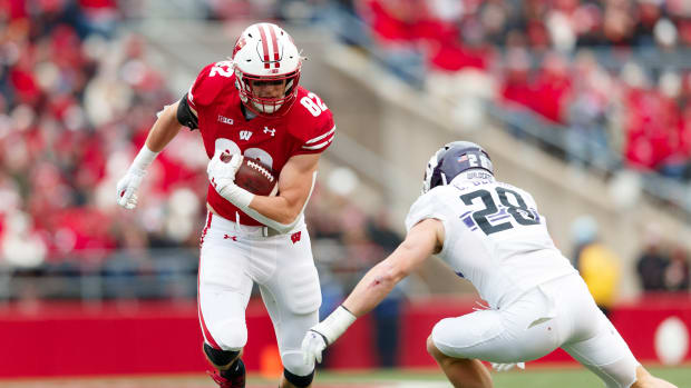 Wisconsin tight end Jack Eschenbach breaks a tackle against Northwestern.