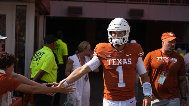 Texas quarterback Hudson Card (1) greets fans while walking onto the field before the game against Alabama at Royal Memorial Stadium on Sep. 10, 2022.