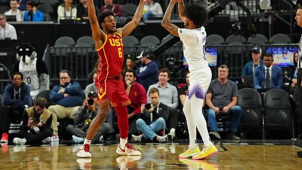 USC Trojans guard Bronny James defends Washington Huskies guard Koren Johnson.