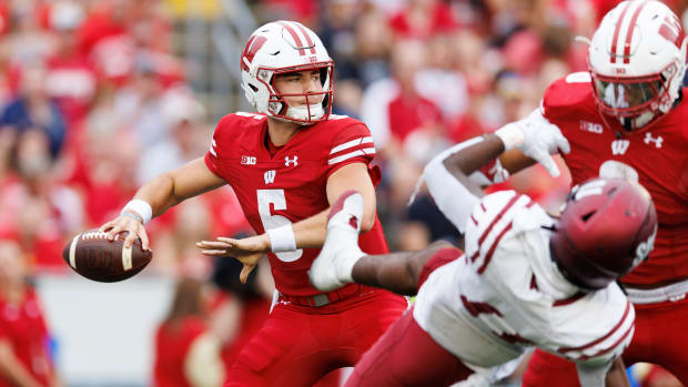 Wisconsin quarterback Graham Mertz dropping back to pass against New Mexico State.