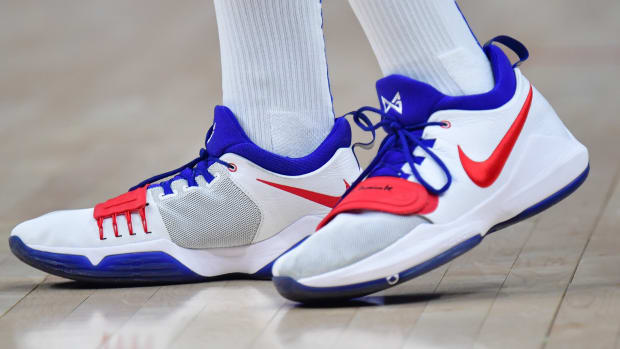 Los Angeles Clippers forward Paul George's white, red, and blue Nike sneakers.