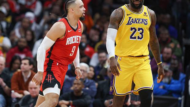 Rockets forward Dillon Brooks reacts toward Los Angeles Lakers forward LeBron James after scoring a basket during the fourth quarter at Toyota Center.