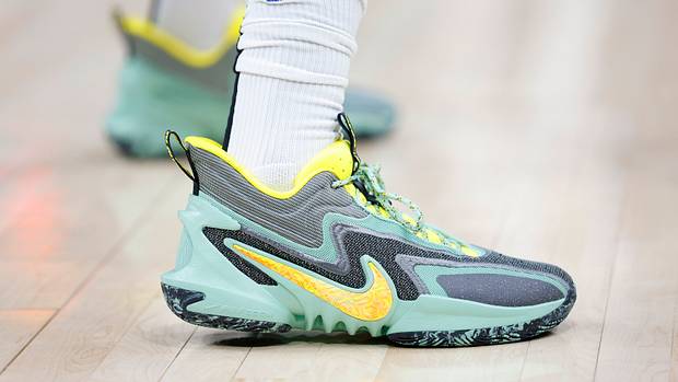View of green and yellow Nike shoes.