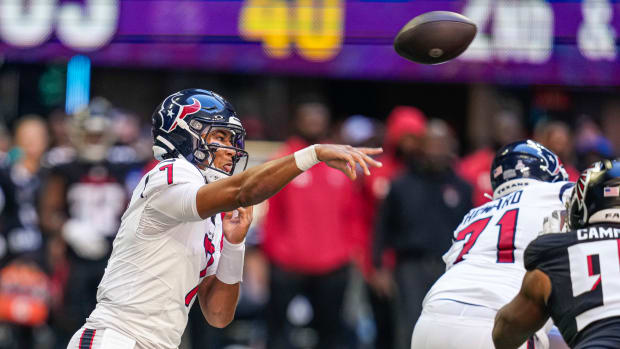Texans quarterback C.J. Stroud (7) passes the ball against the Atlanta Falcons at Mercedes-Benz Stadium
