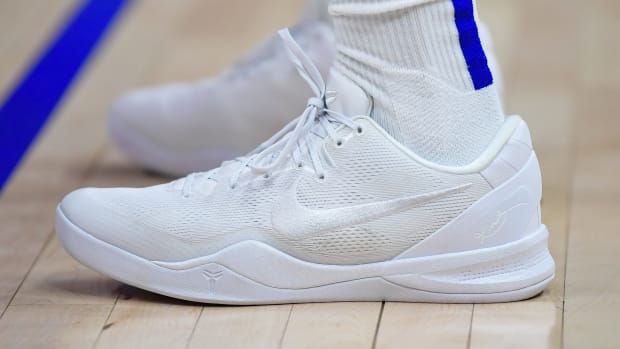 Side view of Kobe Bryant's white Nike sneakers.