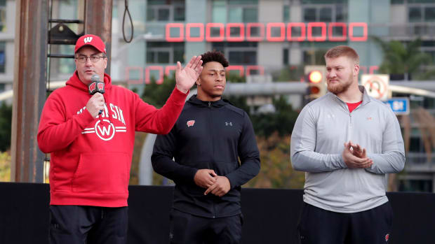 Paul Chryst speaking before the Rose Bowl with Jonathan Taylor and Tyler Biadasz.