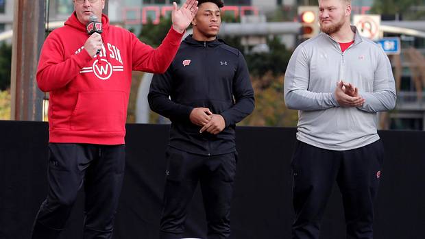 Paul Chryst speaking before the Rose Bowl with Jonathan Taylor and Tyler Biadasz.