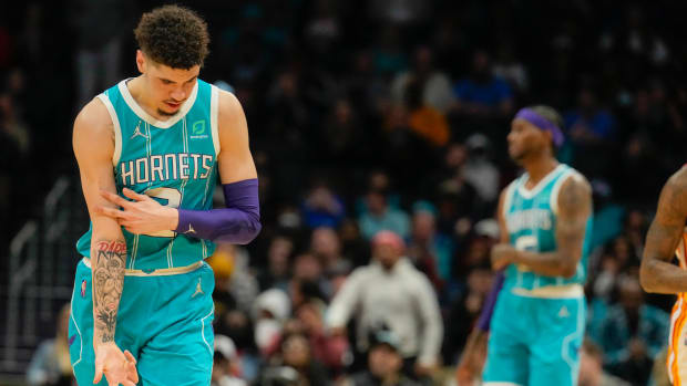 Mar 16, 2022; Charlotte, North Carolina, USA; Charlotte Hornets guard LaMelo Ball (2) reacts to his three point shot against the Atlanta Hawks during the second quarter at the Spectrum Center.