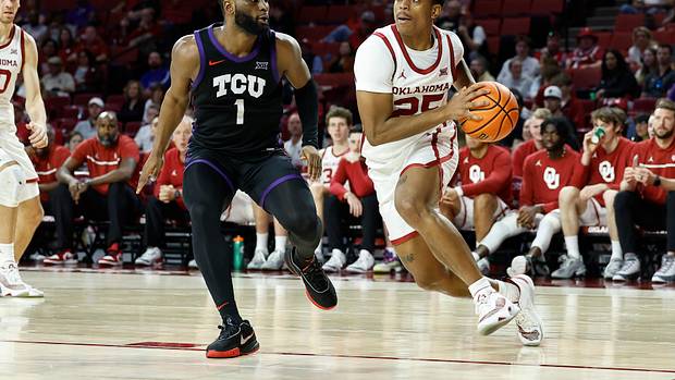 Oklahoma Sooners guard Grant Sherfield dribbles past TCU Horned Frogs guard Mike Miles Jr.